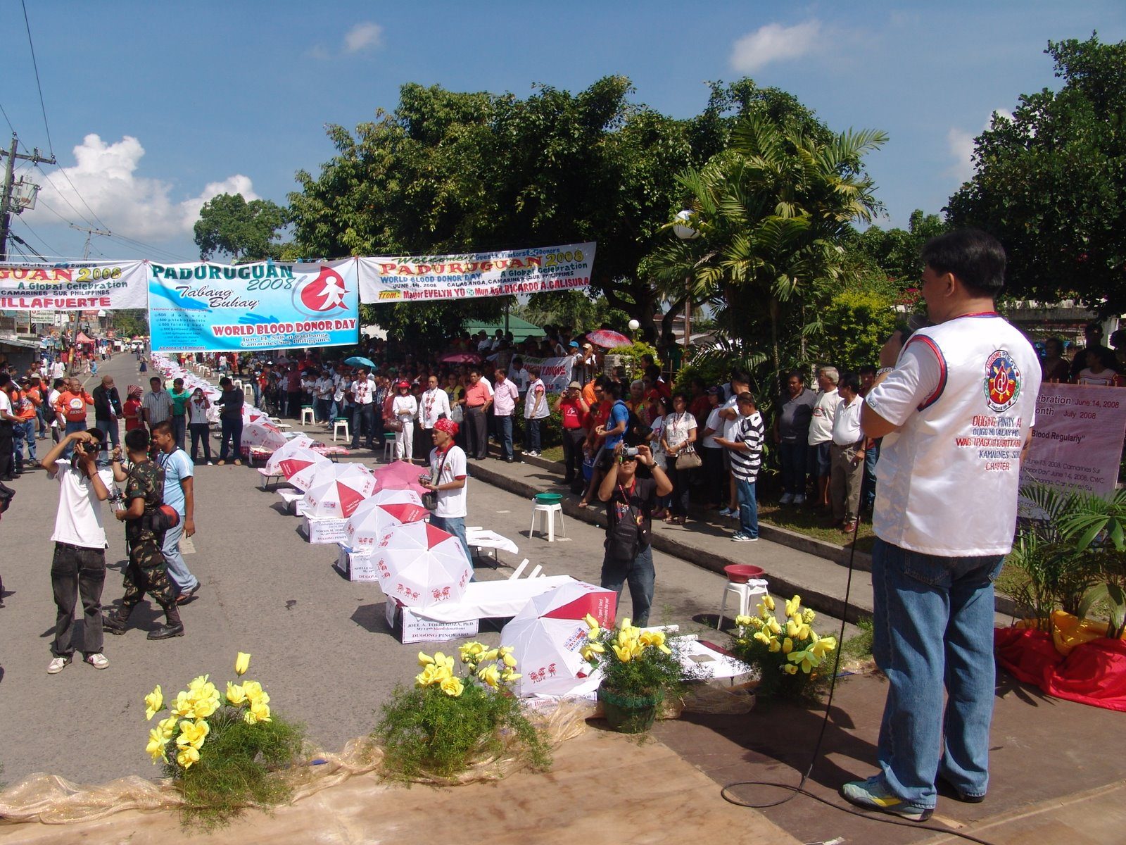 A public blood donation awareness activity with participants gathered outdoors